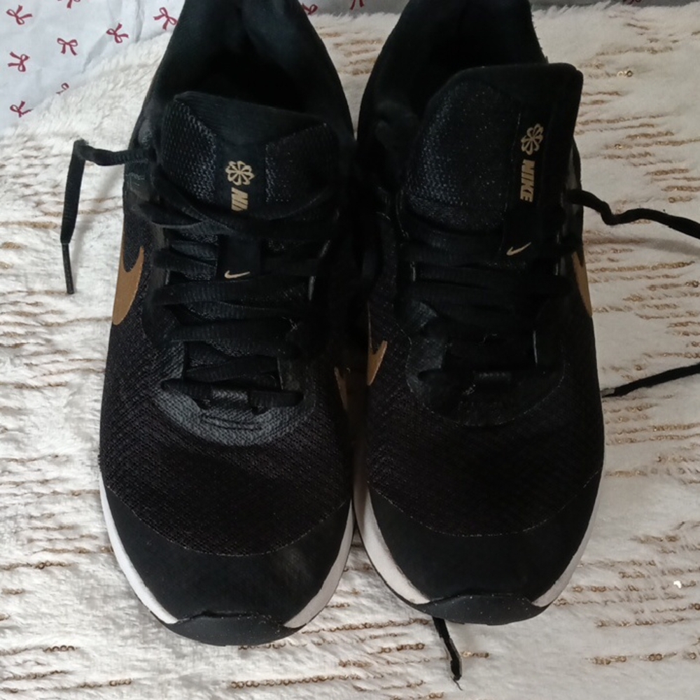 Nike Women's Black Sneakers with Gold Swoosh